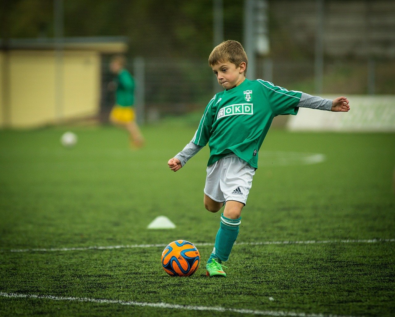 A child playing football.